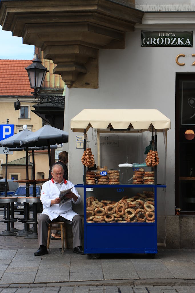 Obwarzanek Krakow street cart blue vendor braided bread ring Poland